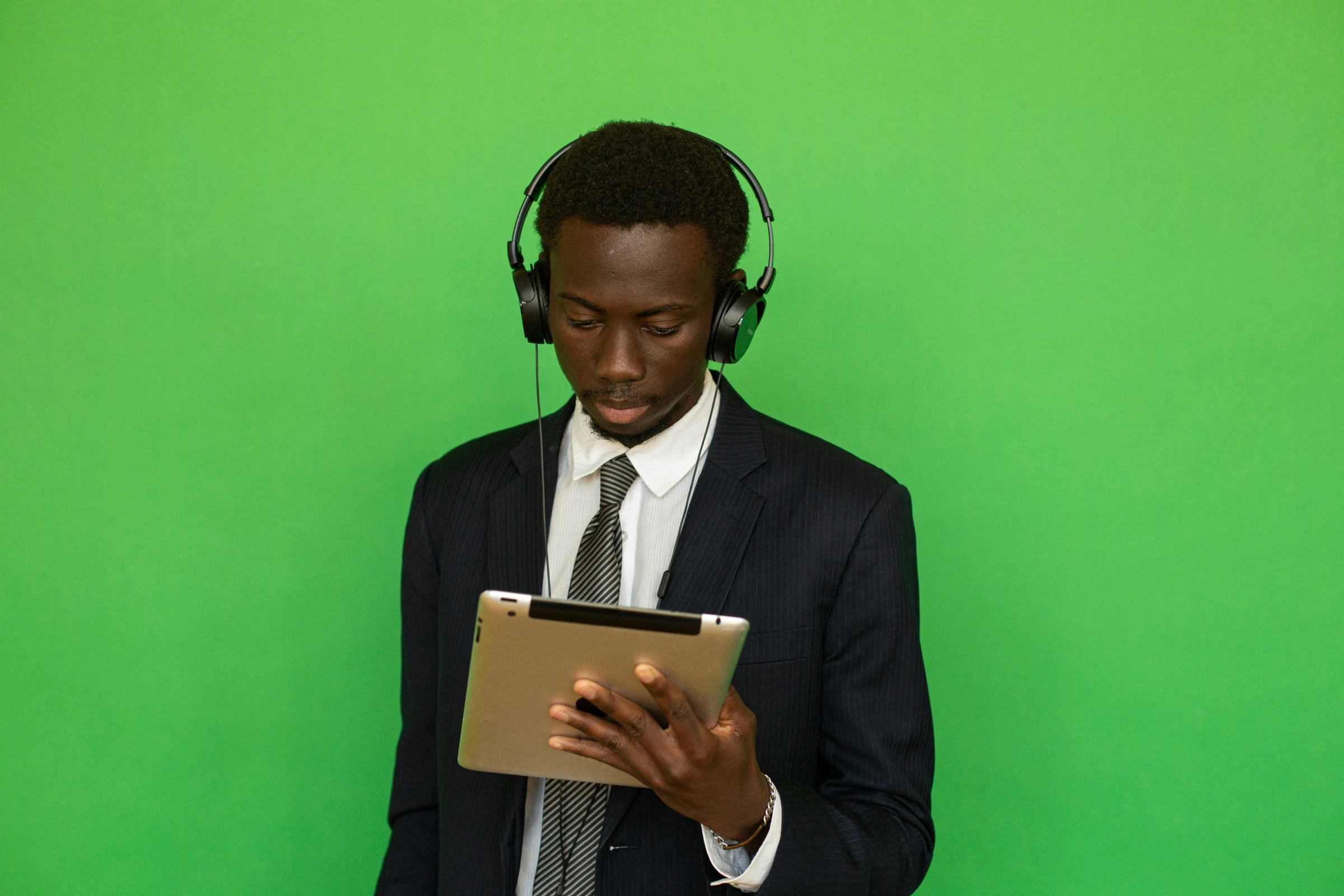 An ICT consultant reviewing a system on a tablet
