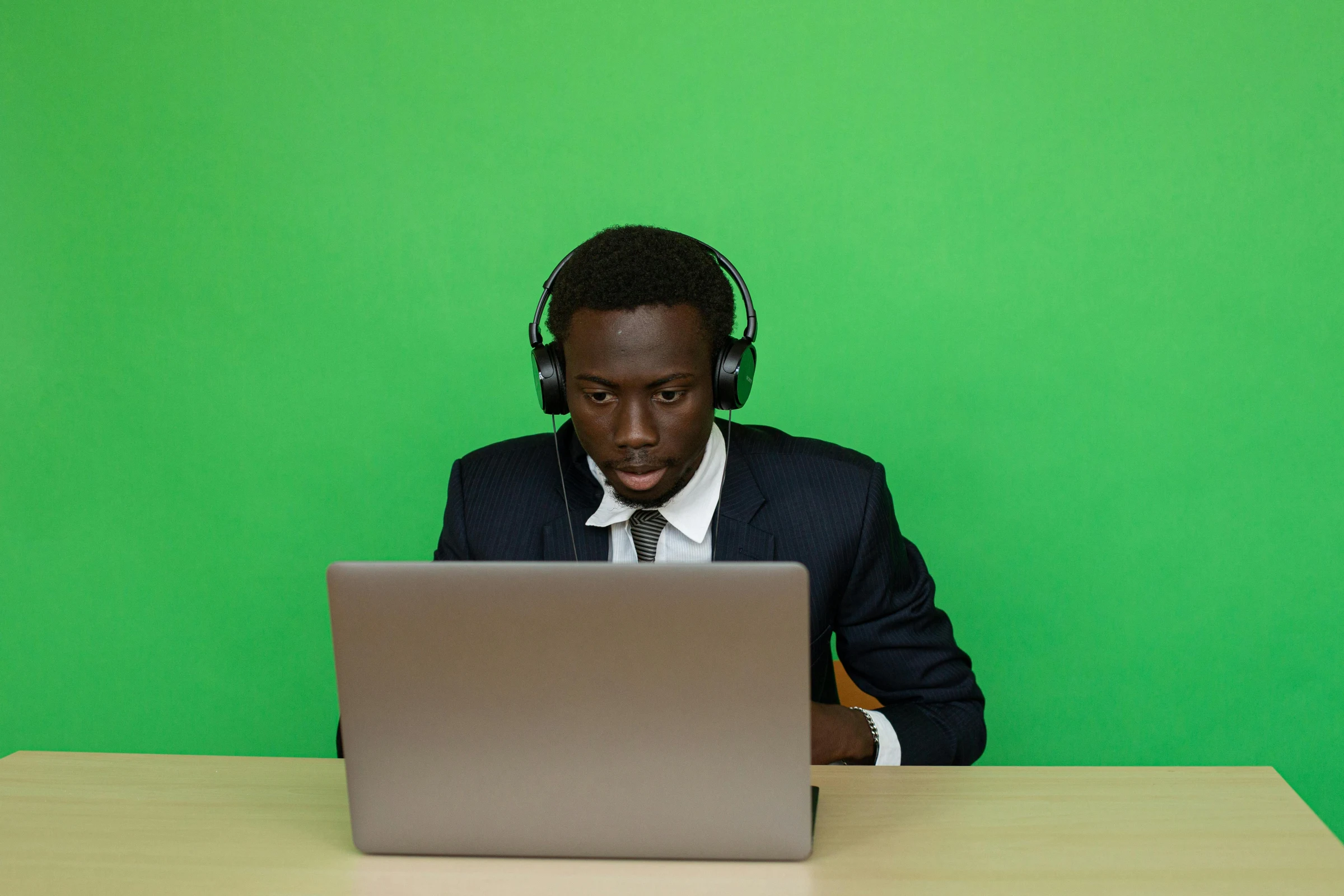 A technical support specialist taking a call at a desk