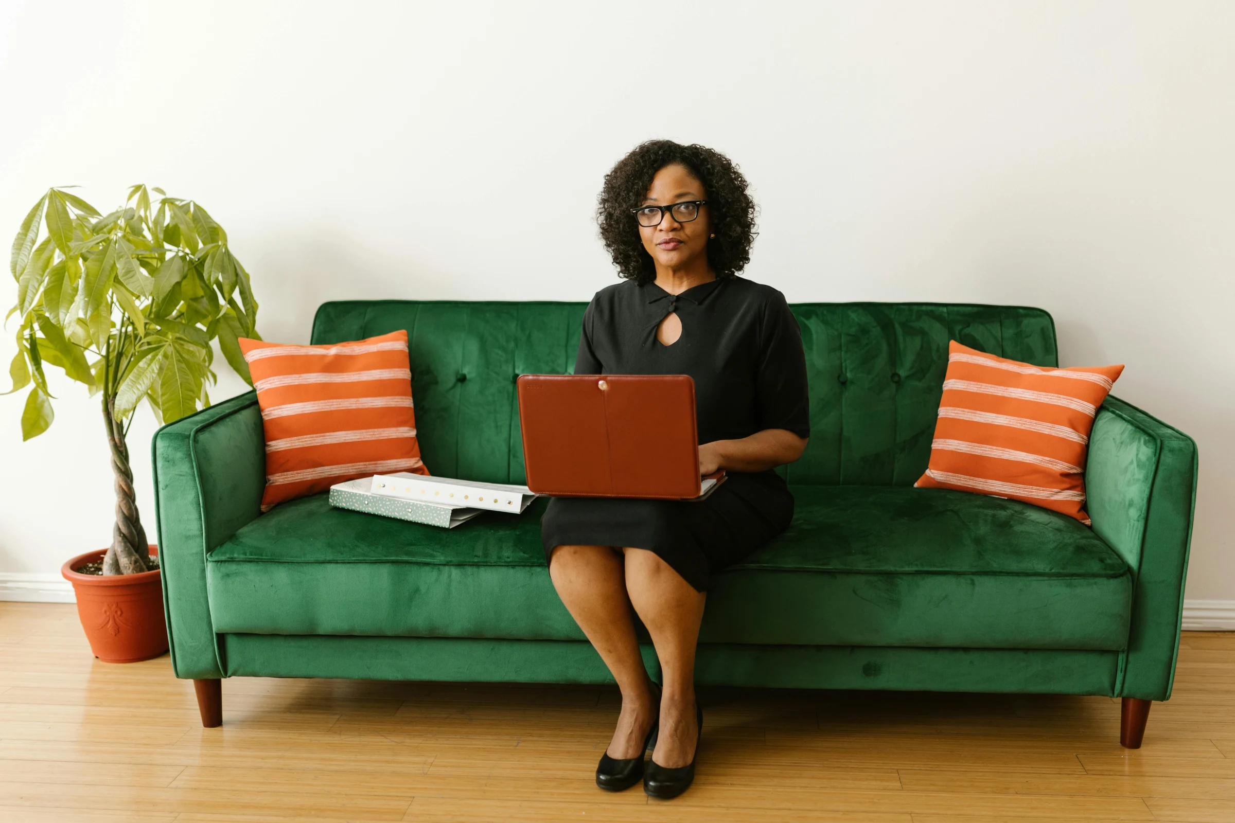 A businesswoman working at a laptop in an office