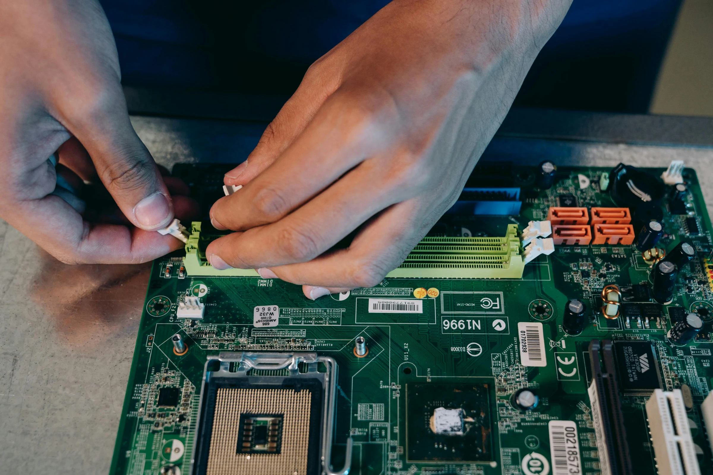 A motherboard being repaired at component level
