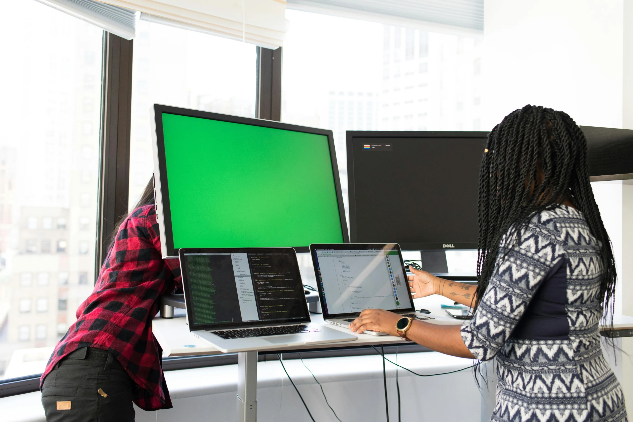 A software development team working together at a desk